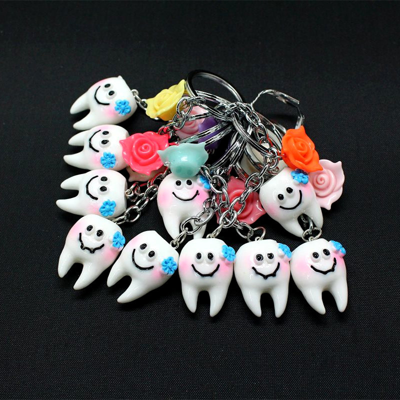 Smiling teeth shape key chain with flower
